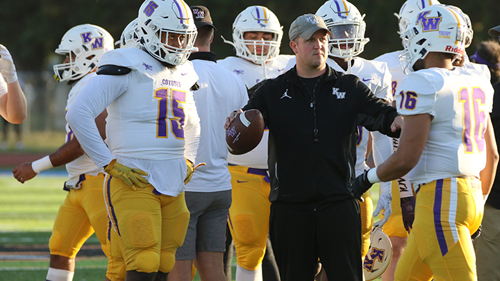 Football action on sidelines