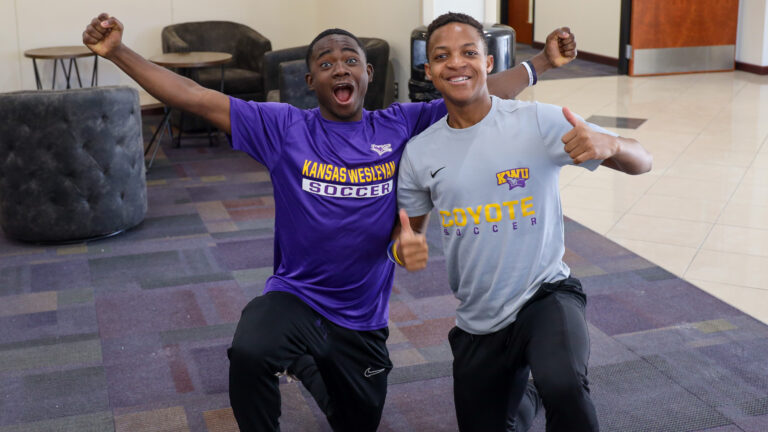 Two male students happy