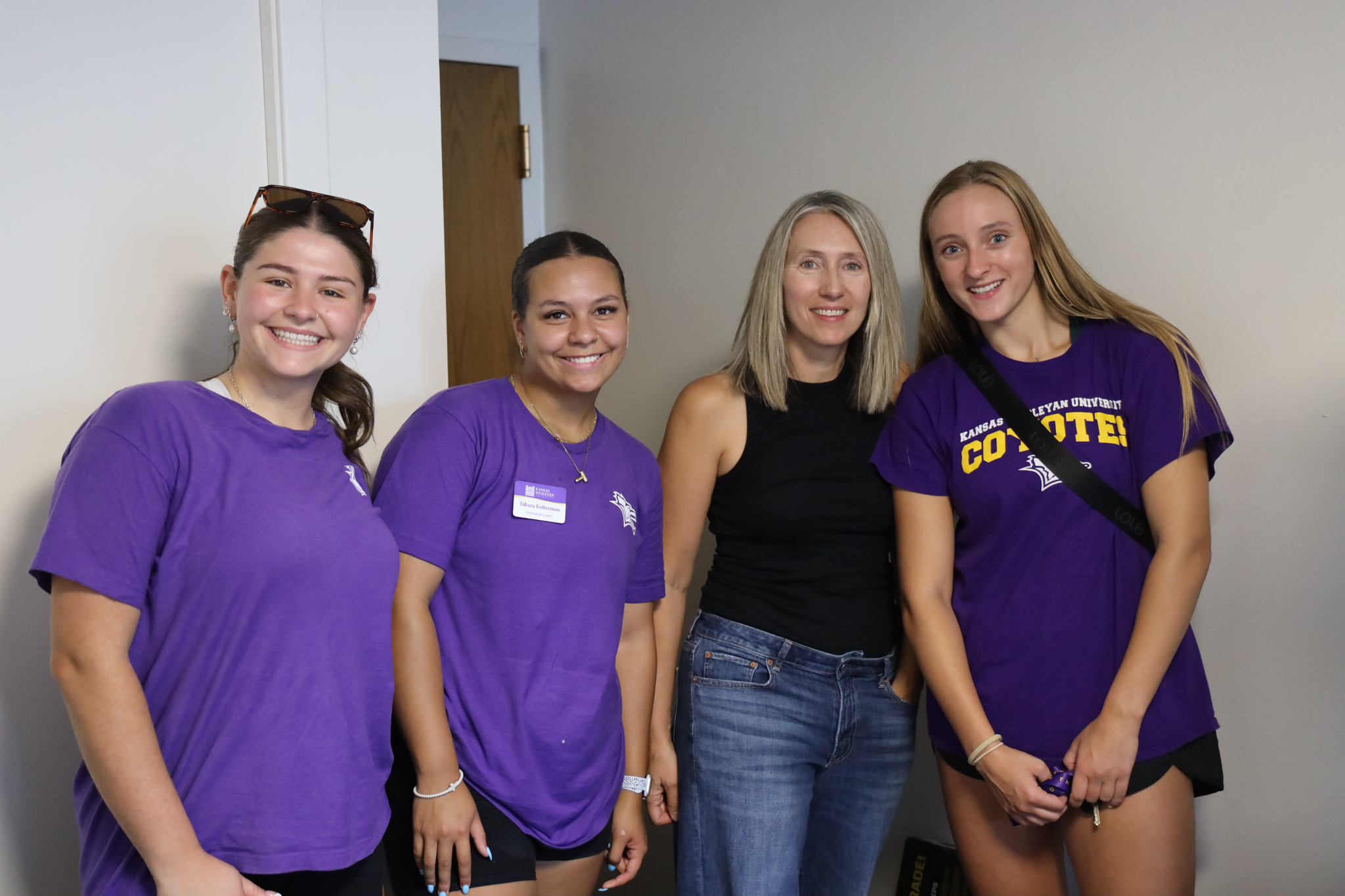 Four females (three students) in dorm during move-in process