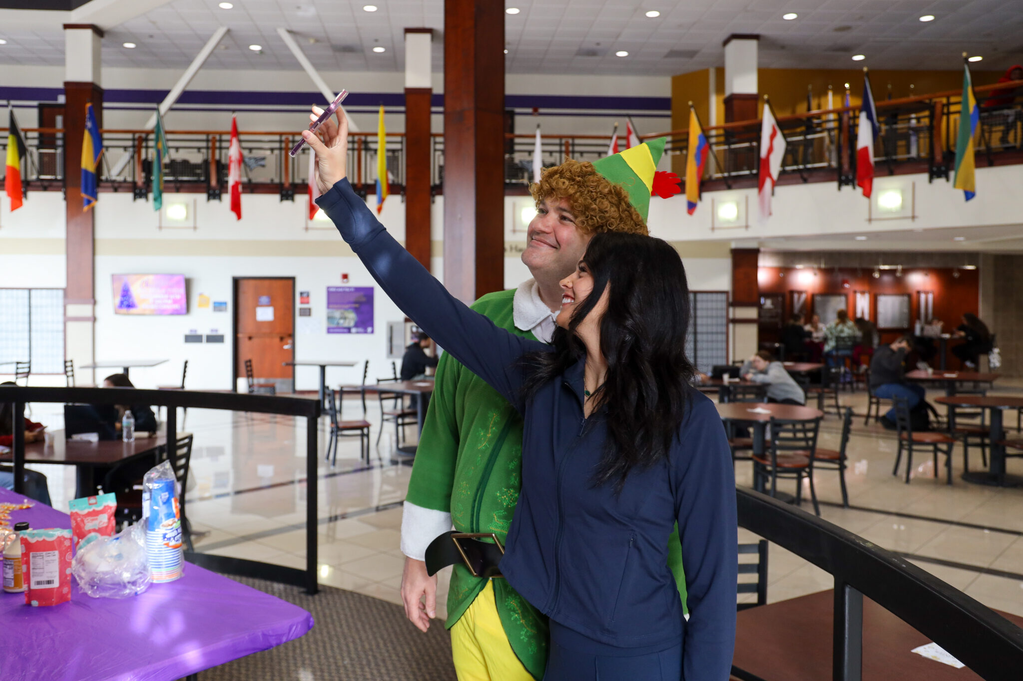 Man and student standing by each other