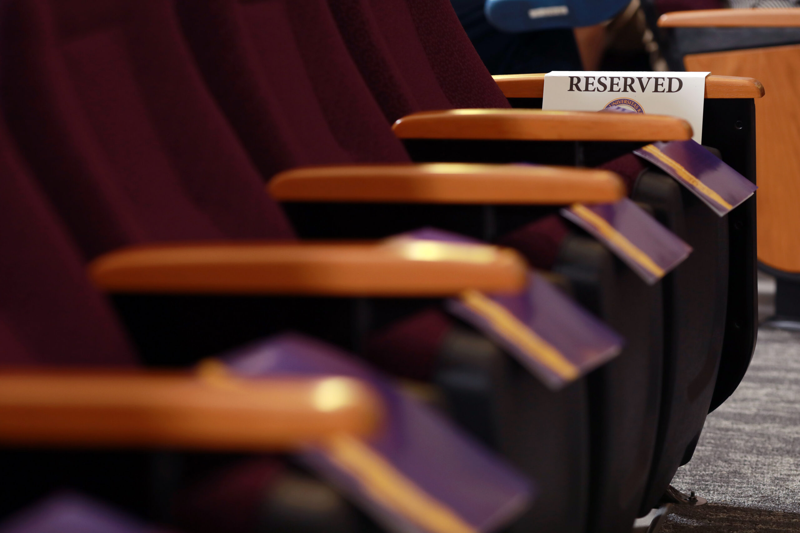 Seats at Nursing pinning ceremony, purple fabric