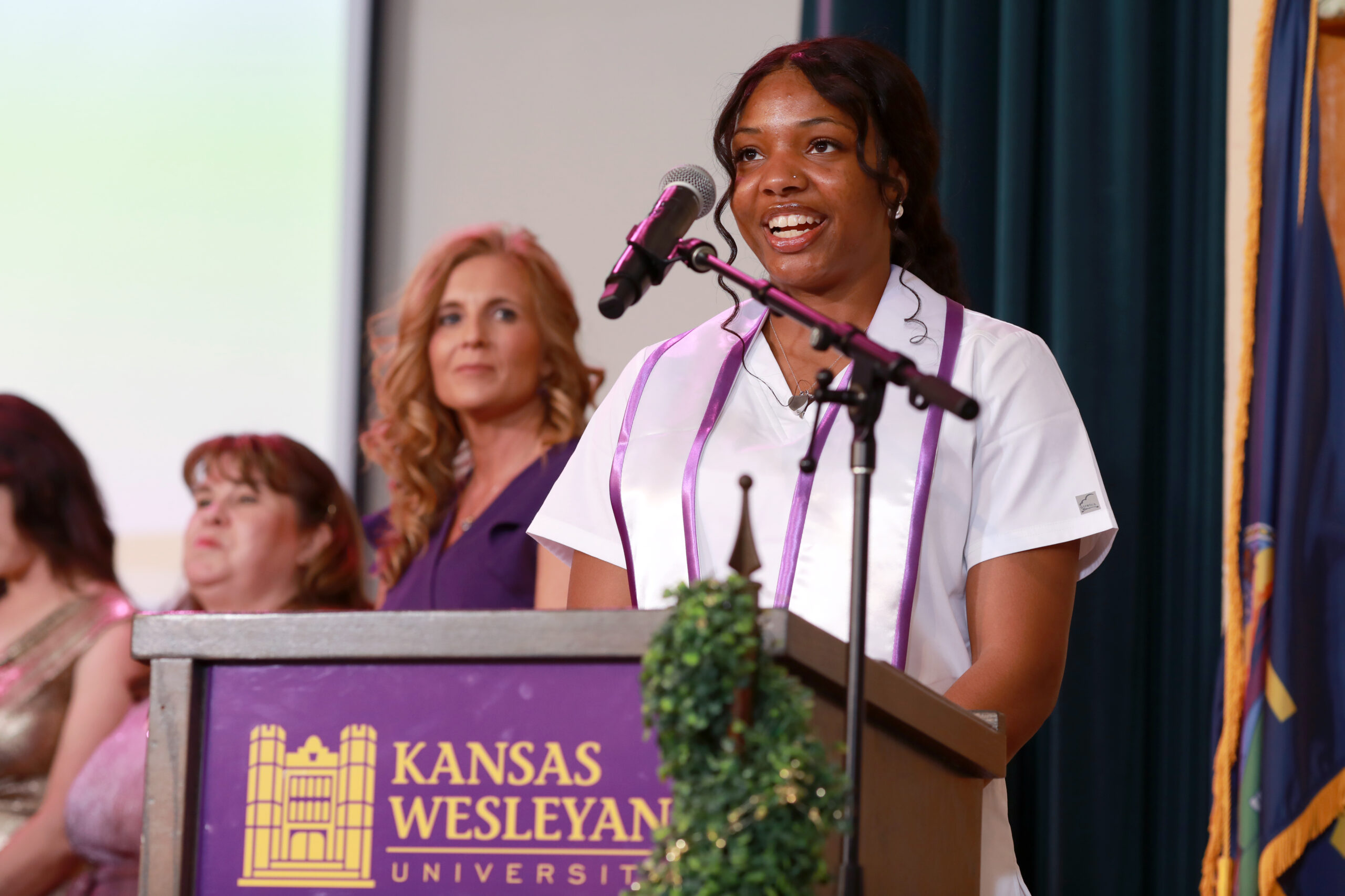 Female speaker at podium