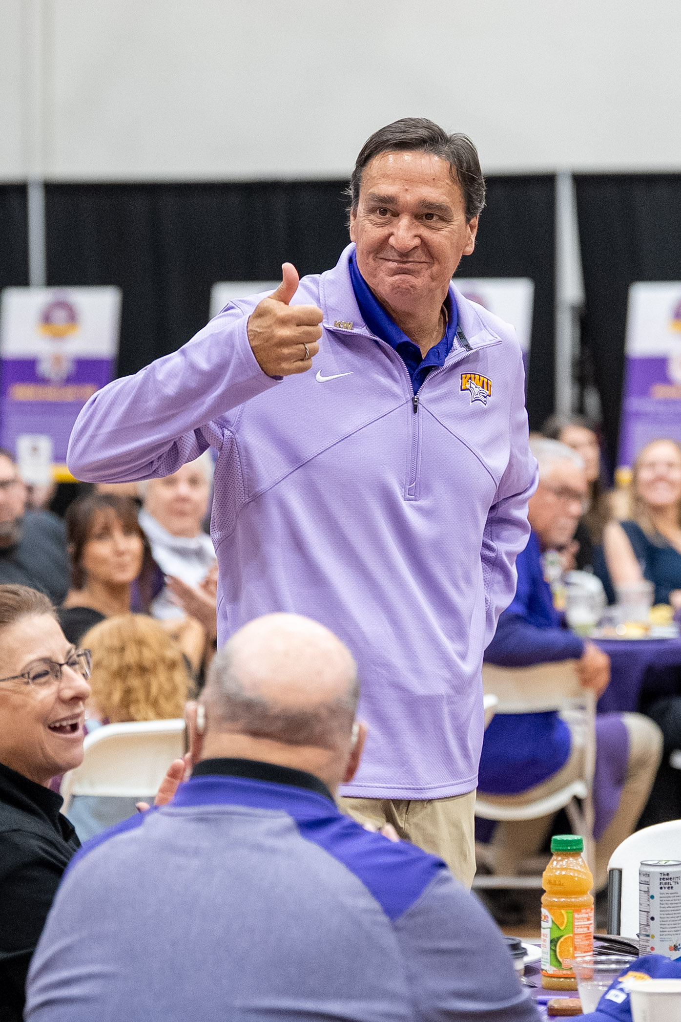 Man standing giving thumbs up