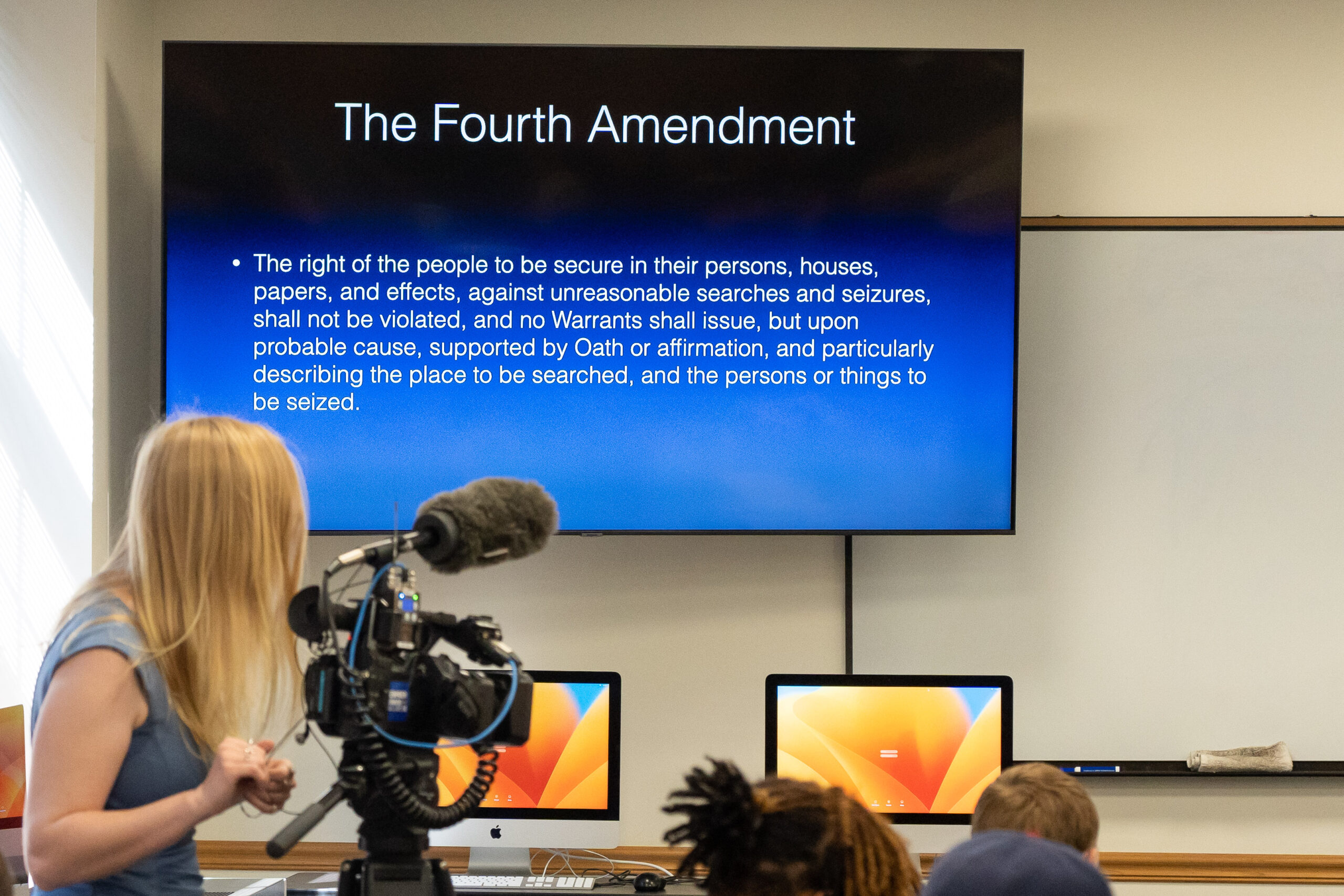 74104925 Speaker talking to students