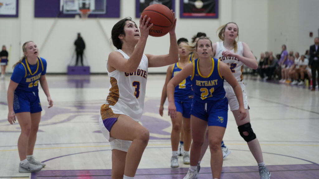 Women's basketball player shooting ball