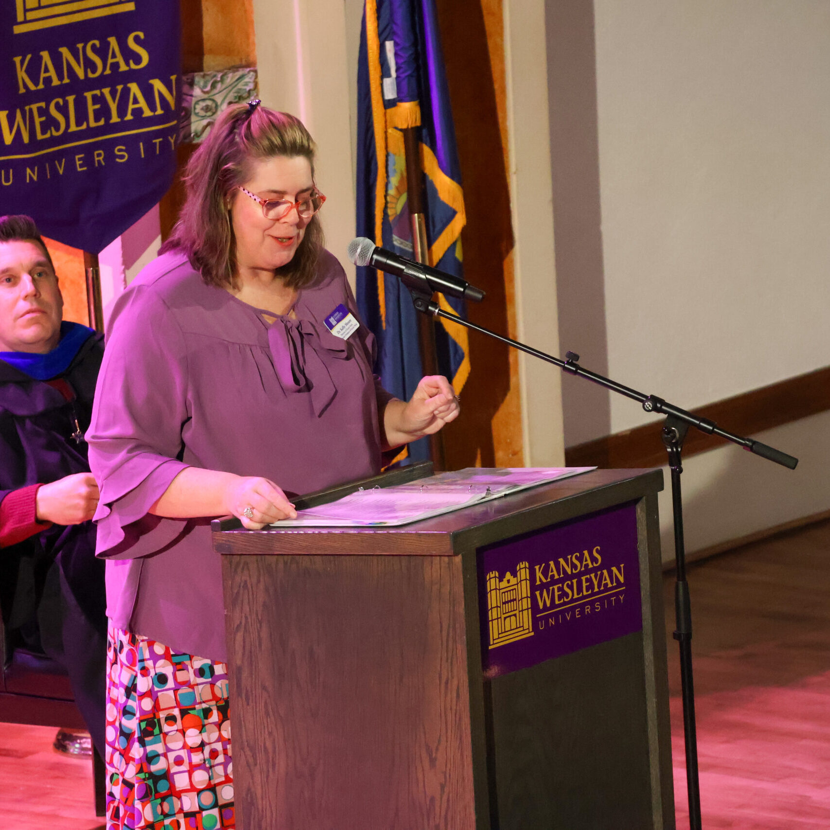 Woman speaking at podium