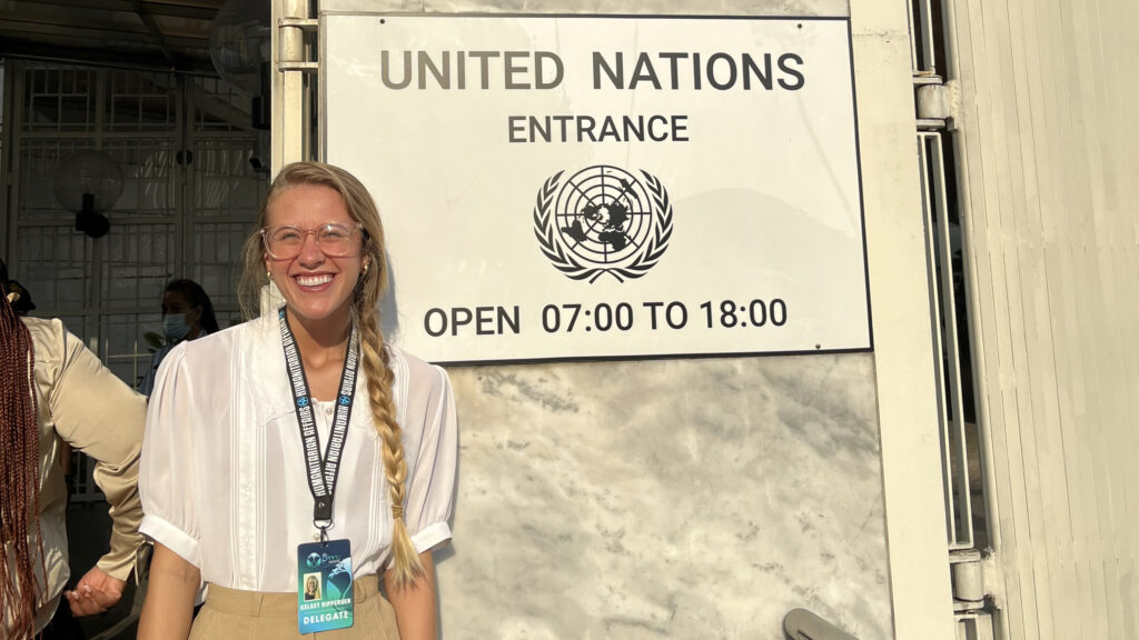 Student in front of UN sign