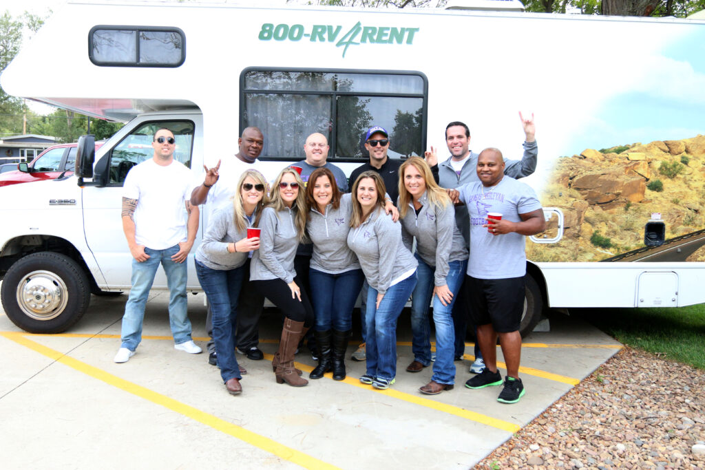 Group gathered around RV