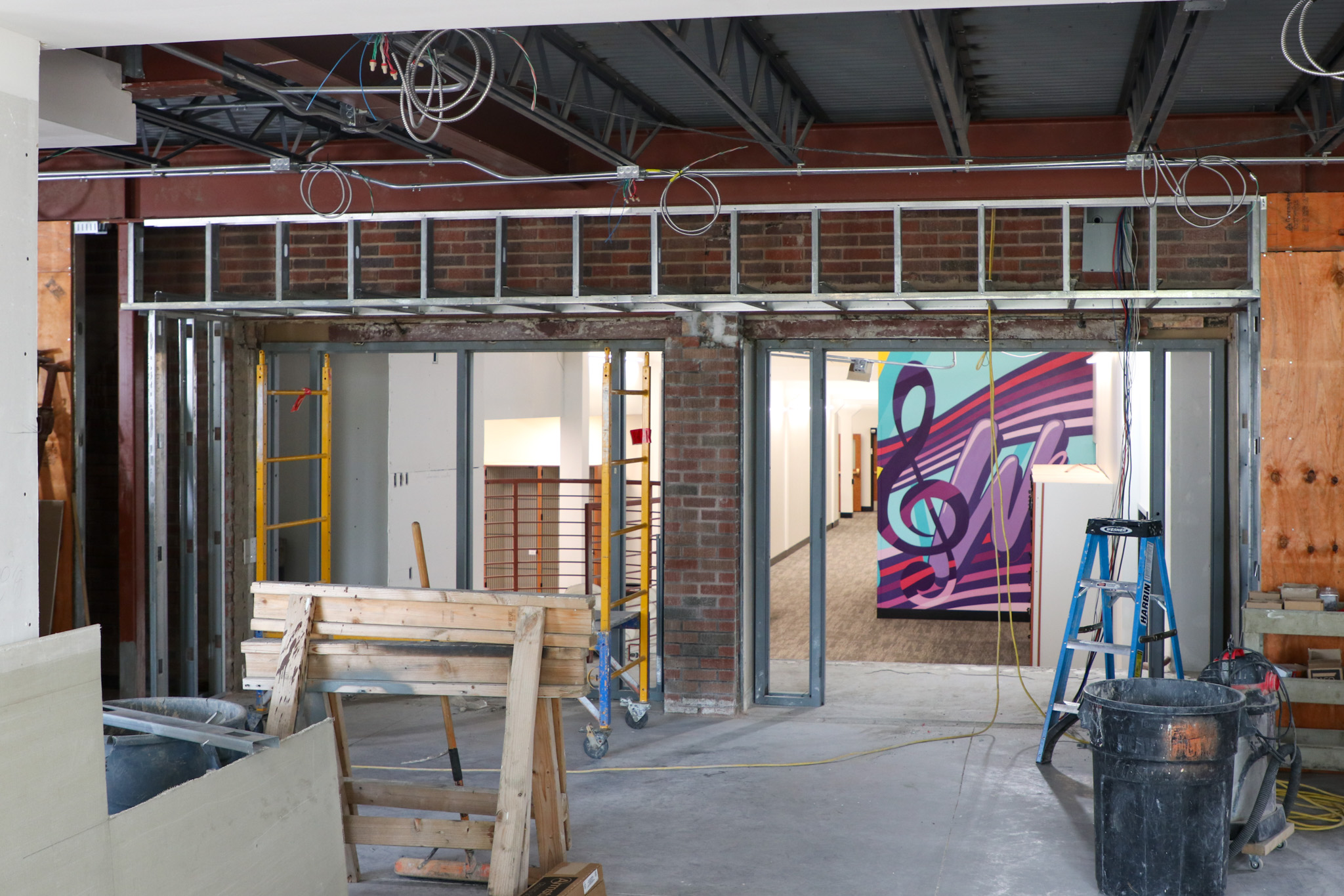 Open wall with musical mural behind it