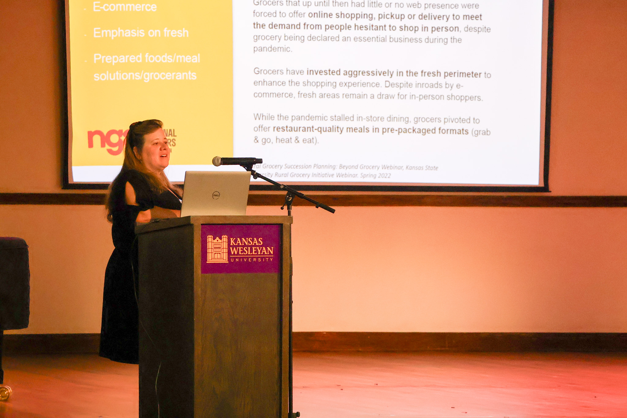 Woman at podium speaking
