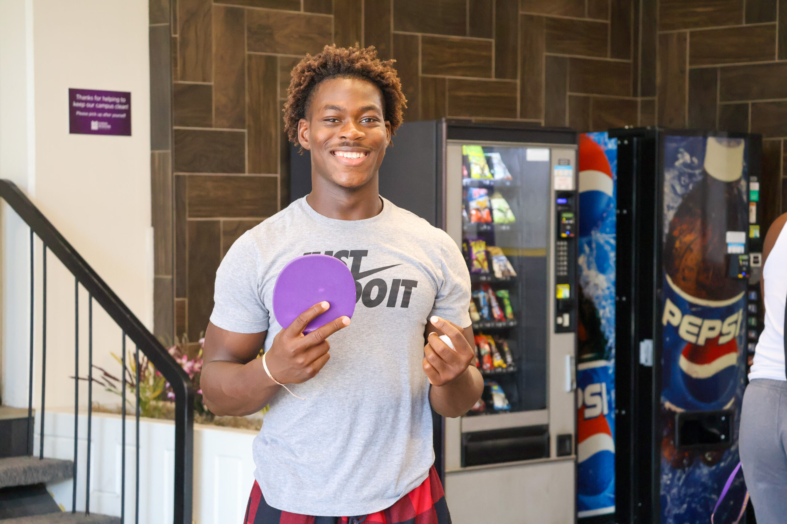 Male student playing table tennis