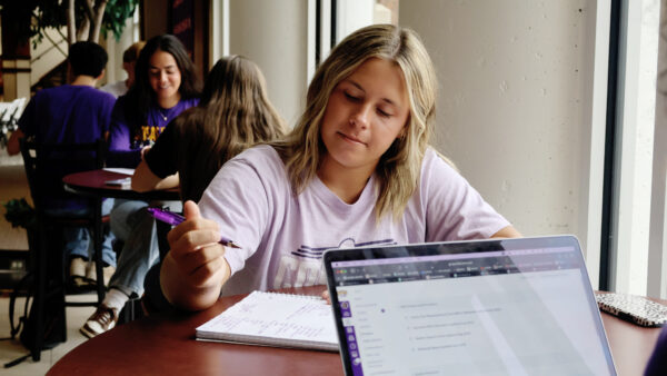 Student studying notebook