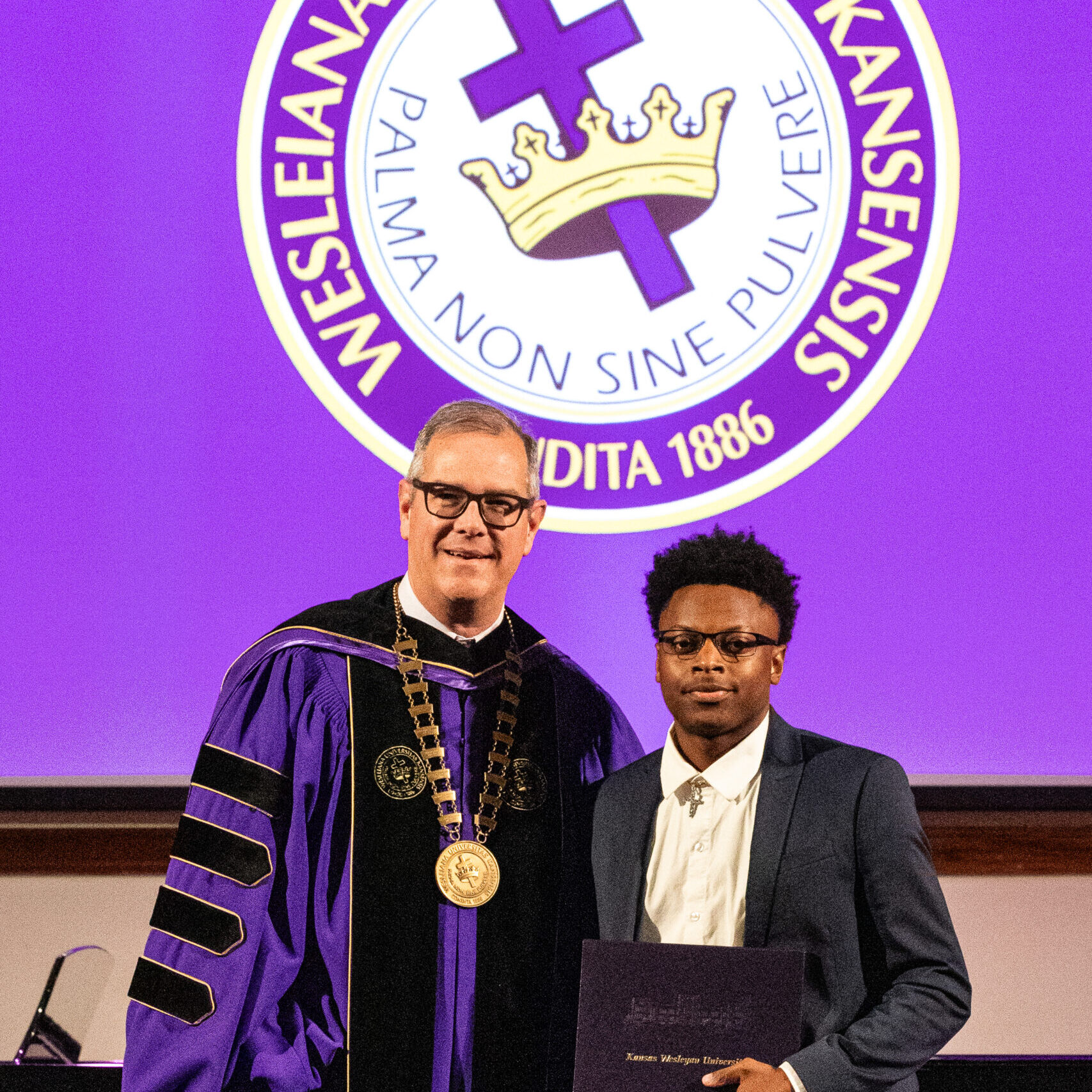 Man with diploma and president