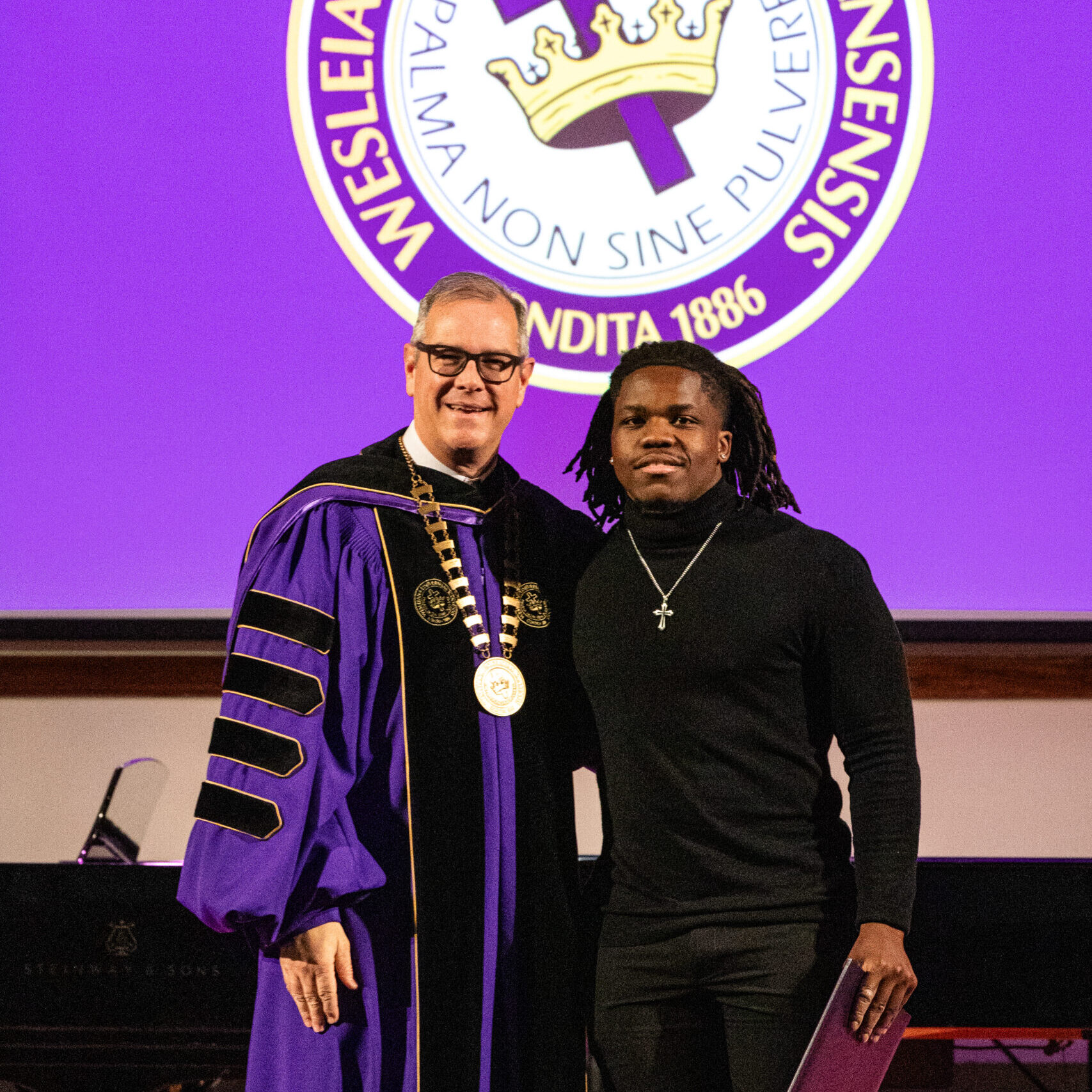 Man with diploma and president