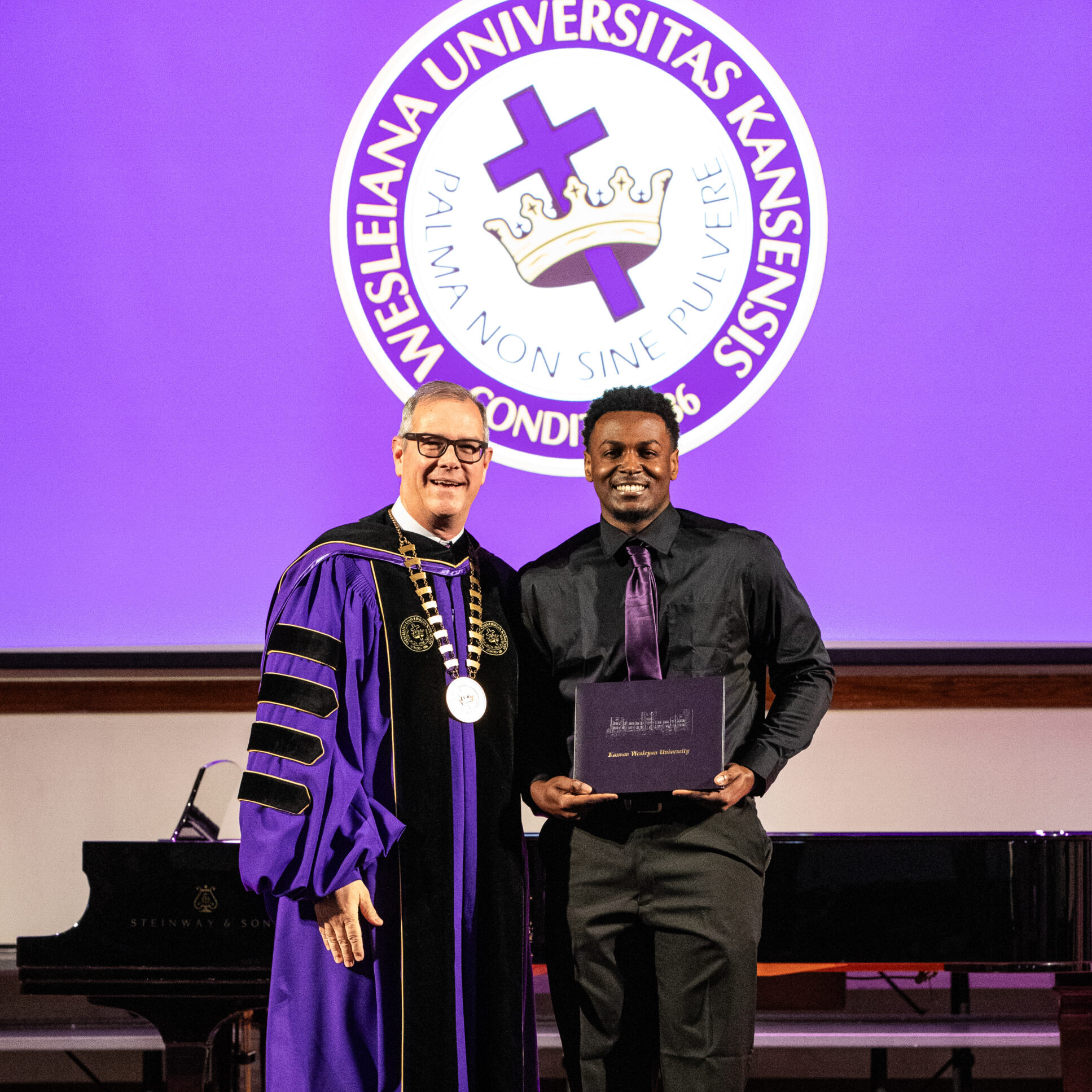 Man with diploma and president
