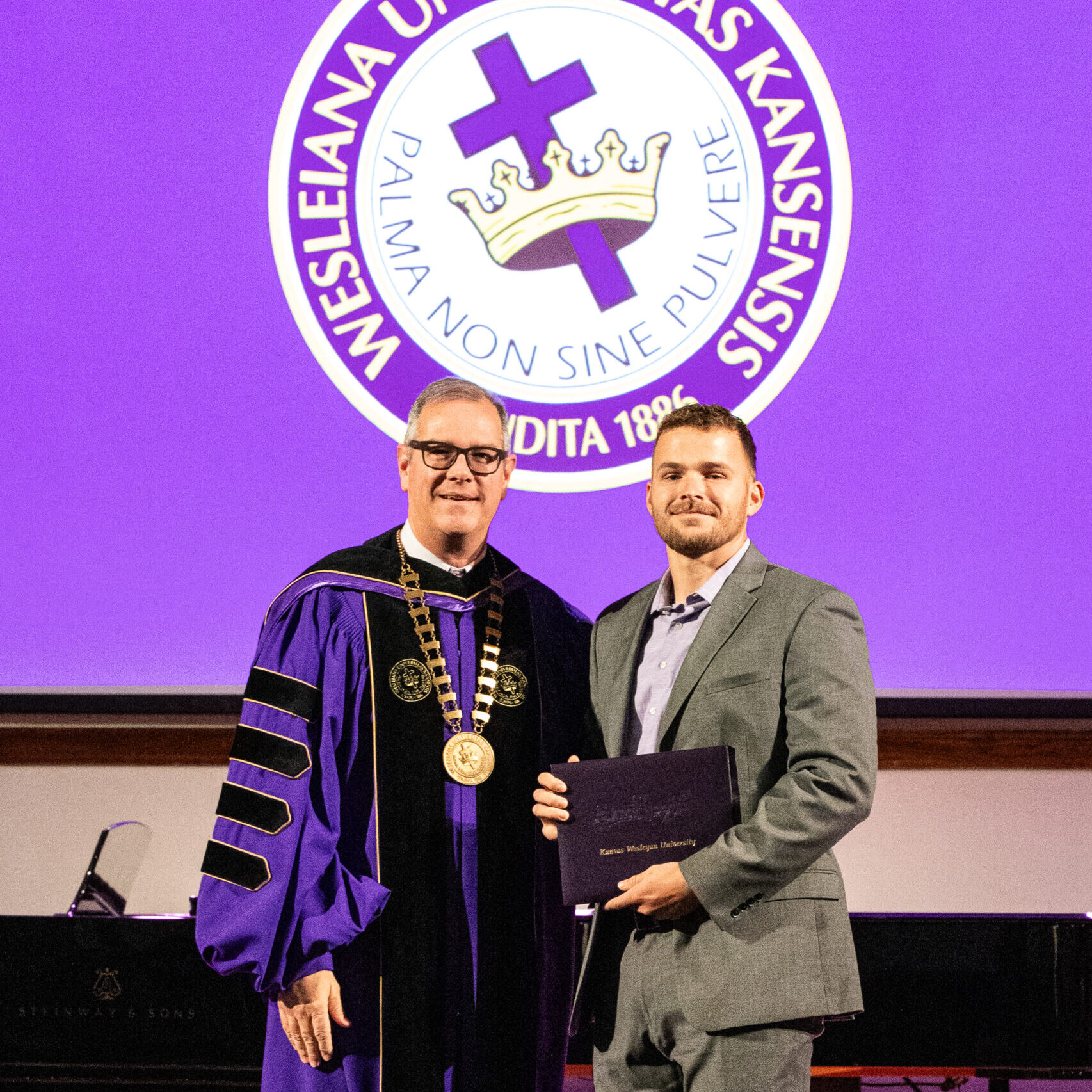 Man with diploma and president