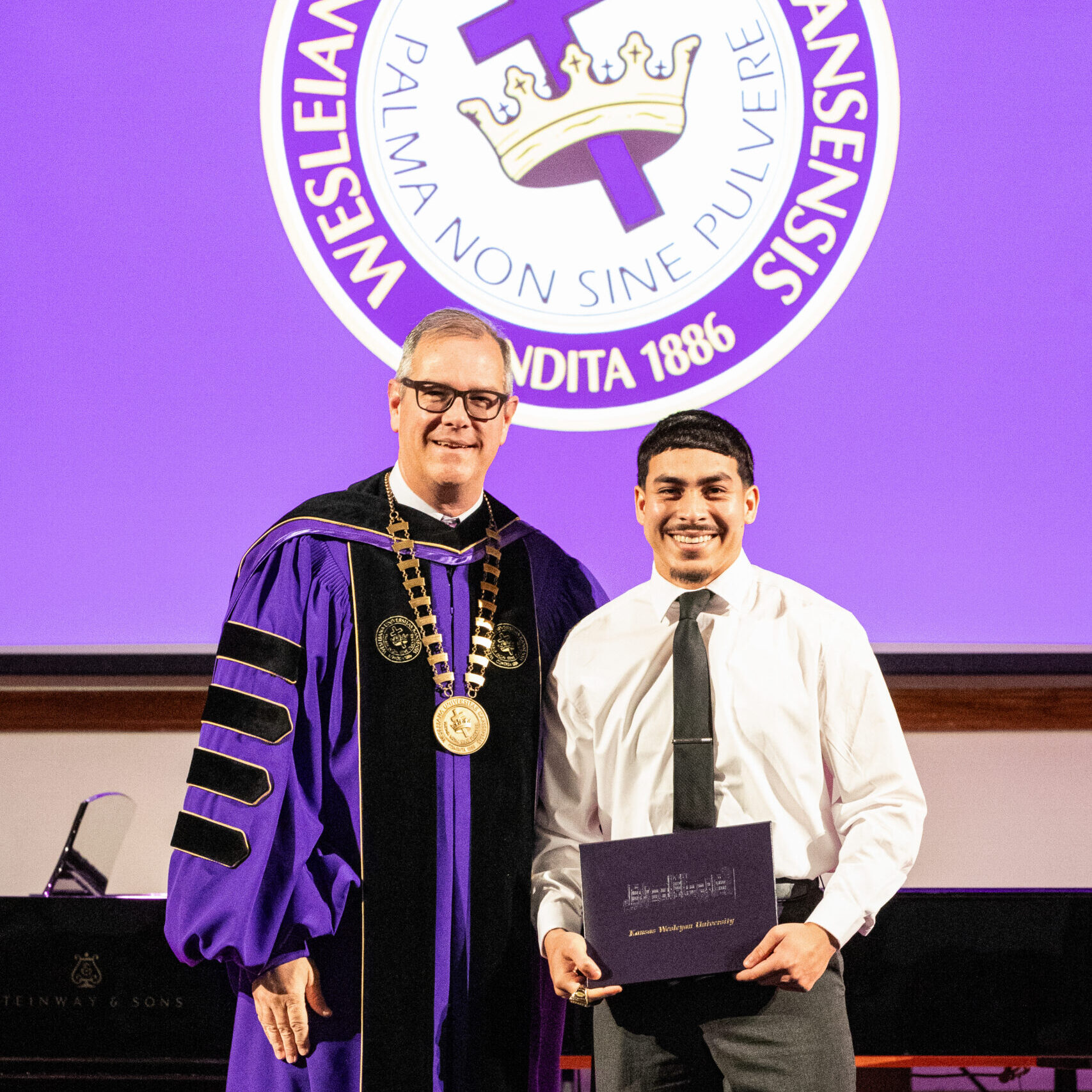 Man with diploma and president