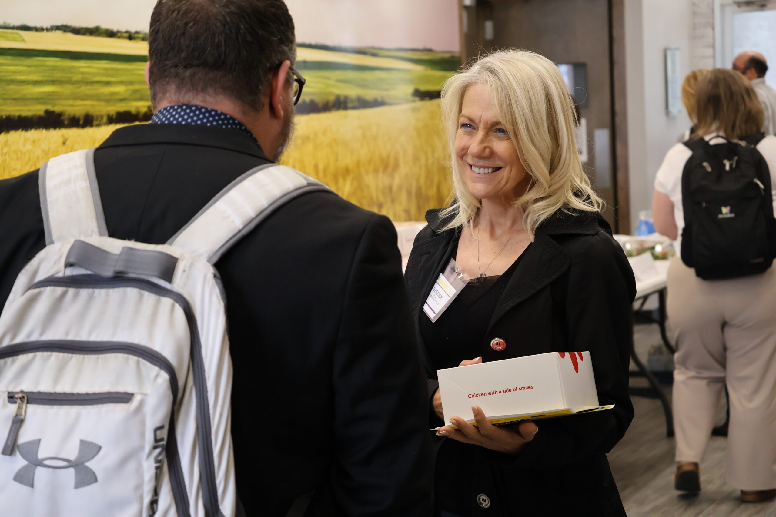 Woman holding chick-fila box