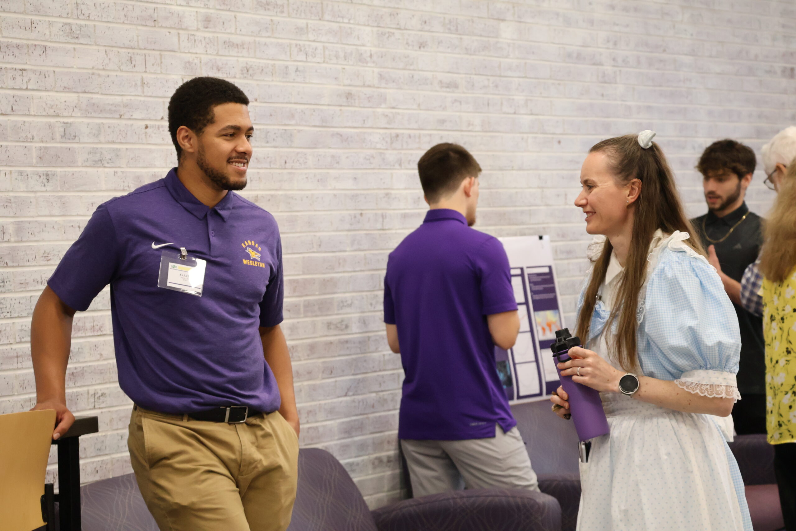 Male student and female professor talking