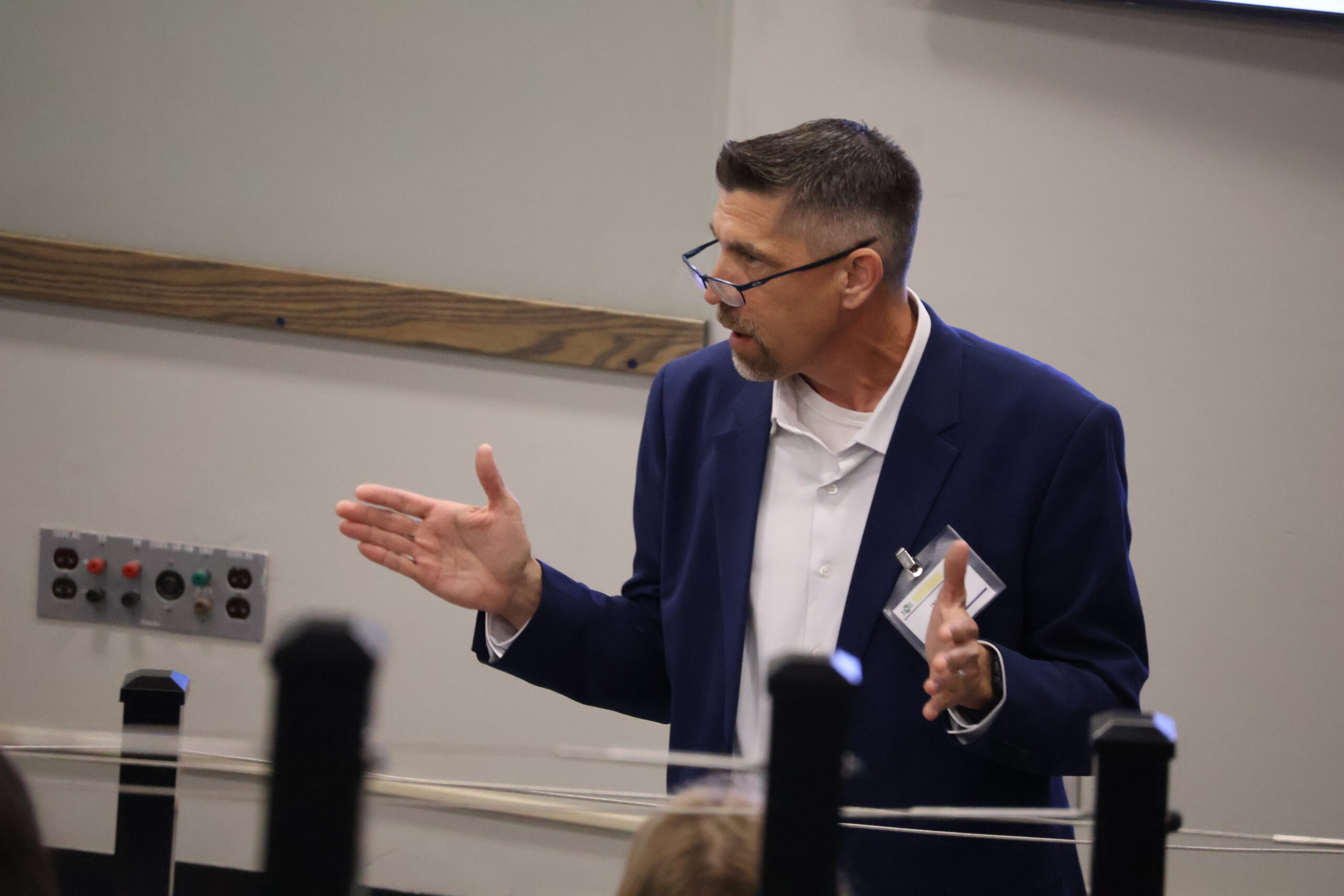 Close up of man speaking to classroom