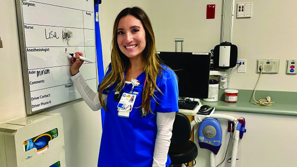 Nurse writing on board